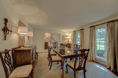 Living room featuring crown molding and hardwood f