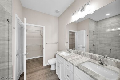Bathroom with vanity, hardwood / wood-style floors