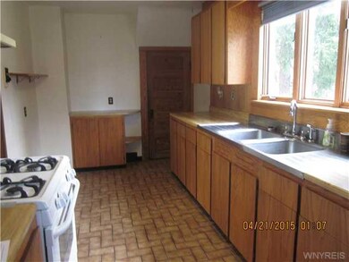 Kitchen. Bright and sunny with ceramic tile floor.