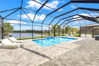 View of pool with a patio area, a water view, and 