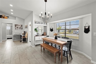 Dining space featuring a notable chandelier, lofte