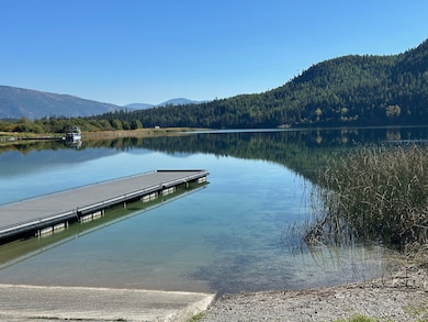 Dock featuring a water and mountain view and a view of trees at Logan State Park - approx. 5 miles from cabin.