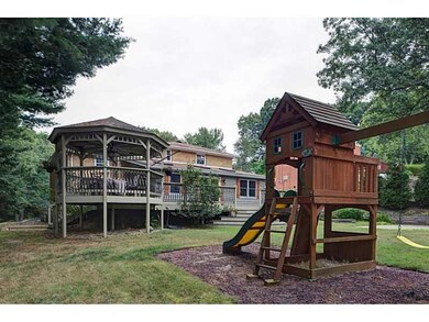 Exterior Back. Swing set and gazebo