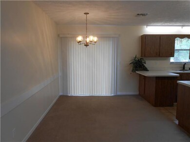 Dining Room. with silder doors to concrete patio..