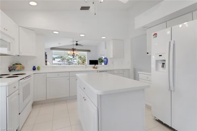 Very LIGHT and BRIGHT kitchen...looking towards living area and lake view