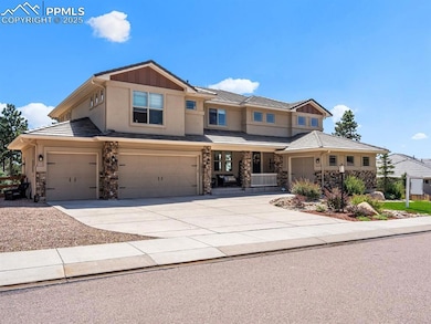 View of front of home with concrete driveway, stone siding, stucco siding, and a tiled roof