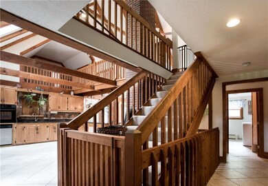 The first floor houses the kitchen,...