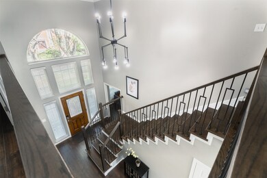 This is a bright and airy entryway featuring high