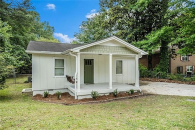 Bungalow-style home featuring board and batten sid