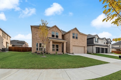 View of front facade with brick siding, driveway, a garage, a porch, and a residential view