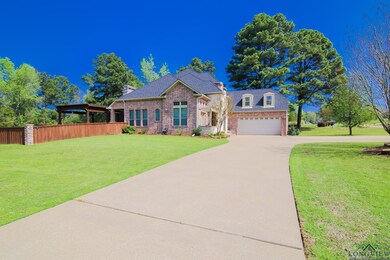 View of front facade featuring fence, an attached 
