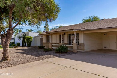 Front with 2 car carport