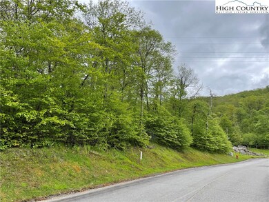 Gentle slope and paved road frontage.