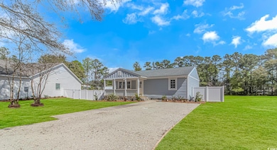View of front facade featuring a front yard, a shi