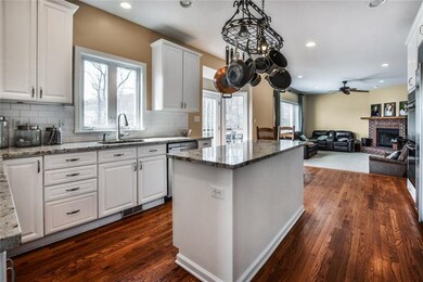 Kitchen opens to family room is and is light and b