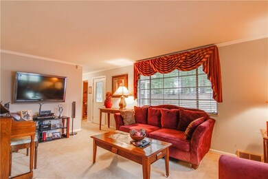 The inviting entry leads to the spacious living ro