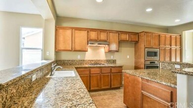 Granite, Stainless, and Lot's Of Cabinets