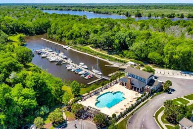 Birds eye view of property with a water view and a