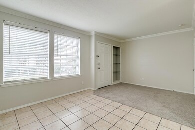 Empty room featuring light tile patterned floors a