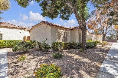 View of property exterior with stucco siding and a