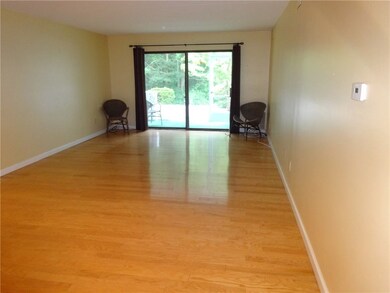 Living Room with Sliders to Private Screened in Pa
