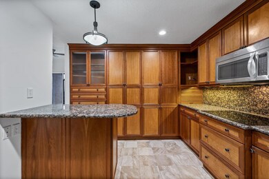 Kitchen with decorative backsplash, black electric
