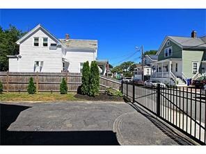 Exterior Back. Low maintenance fenced lot. Perfect
