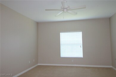 Unfurnished room with light carpet, baseboards, an