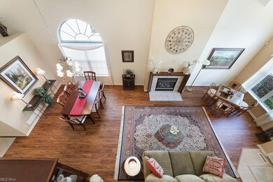 Looking down on living/dining room from loft