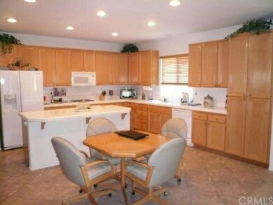 Gourmet kitchen and dinette open to family room.