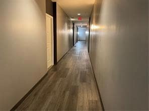 Hallway featuring dark hardwood / wood-style floor