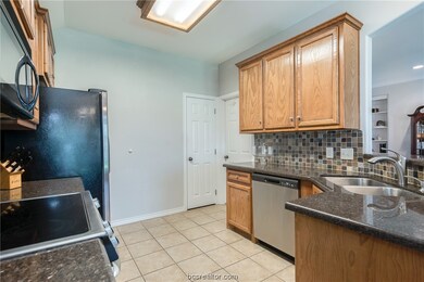 View of kitchen and entrance to garage and pantry