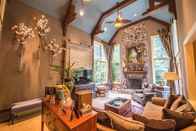 FAMILY ROOM - STONE FIREPLACE EXTENDS 20 FEET.  BE