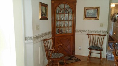 Corner cabinet in eat-in kitchen.