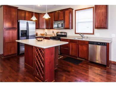 Maple cabinets and flooring with rich cherry stain