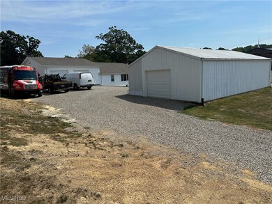 View of front facade featuring a garage