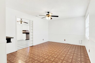 This main room has a cute built-in shelving unit l