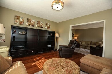 Media Room w/ wide plank wood floors looking towar