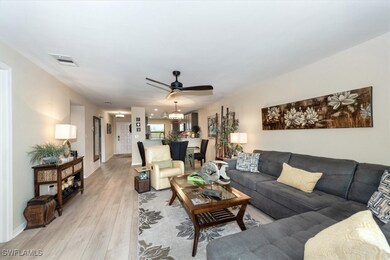 Living room featuring light wood-type flooring, a