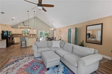 Living room featuring dark wood-style flooring, ce