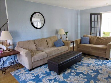 Another view of the living room, showing door to d