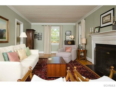 The formal living room has a wood-burning fireplac