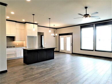 Large windows overlook the back yard.
