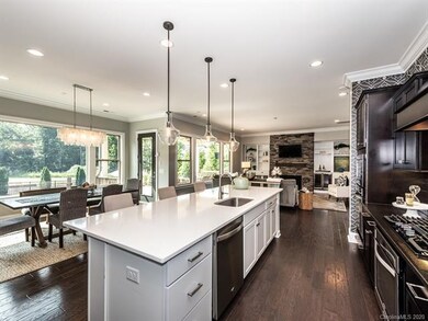Kitchen view to breakfast nook and great room and 