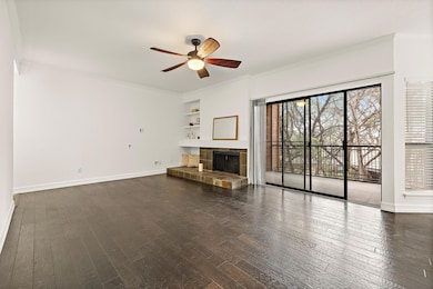 Unfurnished living room with built in shelves, ba
