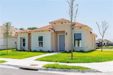 Mediterranean / spanish-style home with a front yard