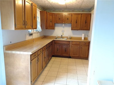Kitchen with plenty of Cabinets and a Dinette/Brea