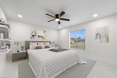 Master Bedroom featuring recessed lighting and a ceiling fan and two walk-in closets