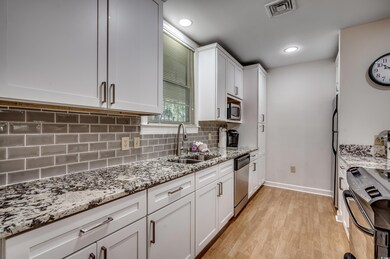 Kitchen with stainless steel appliances, granite c