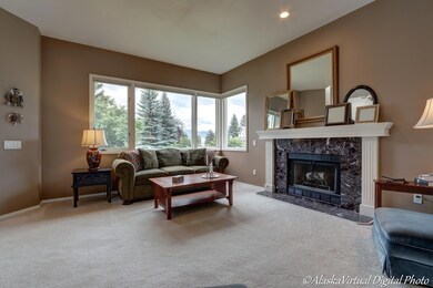 Living room offers a view of the Chugach